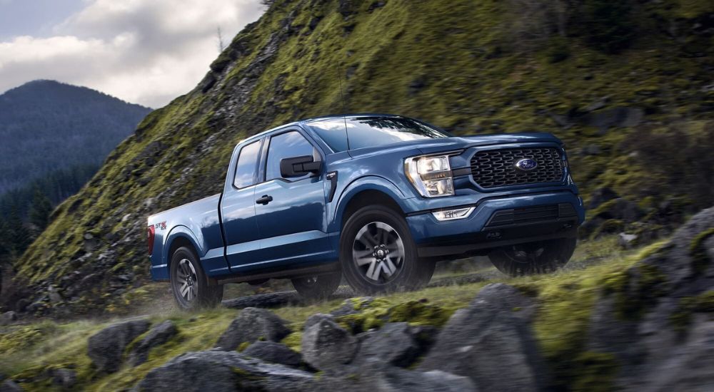 Blue 2023 Ford F-150 parked off-road