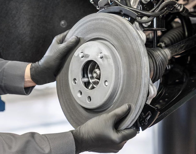 mechanic working under car