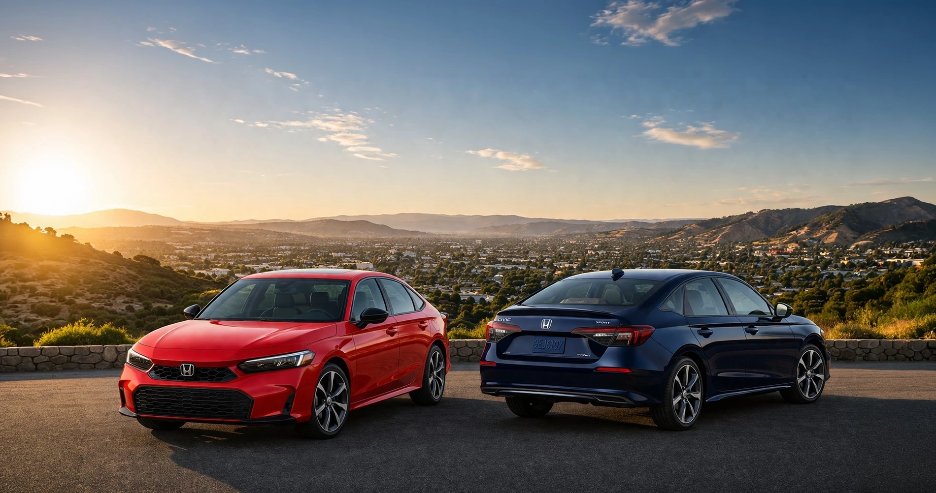 Red 2026 Honda Civic Sedan and navy blue 2026 Honda Civic Sedan parked at a scenic Tracy, California overlook during golden hour, with sweeping Central Valley views, rolling hills, and suburban valley landscape in the background.