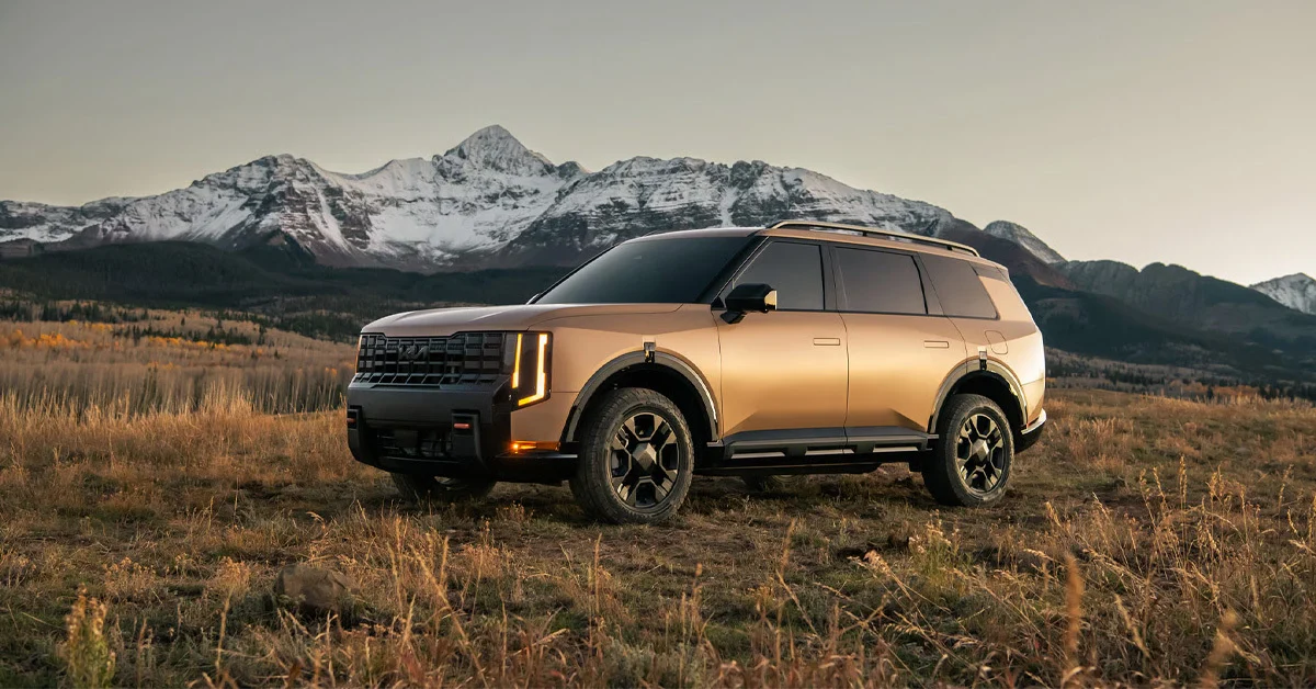 2027 Kia Telluride parked in a field of dry, golden grass