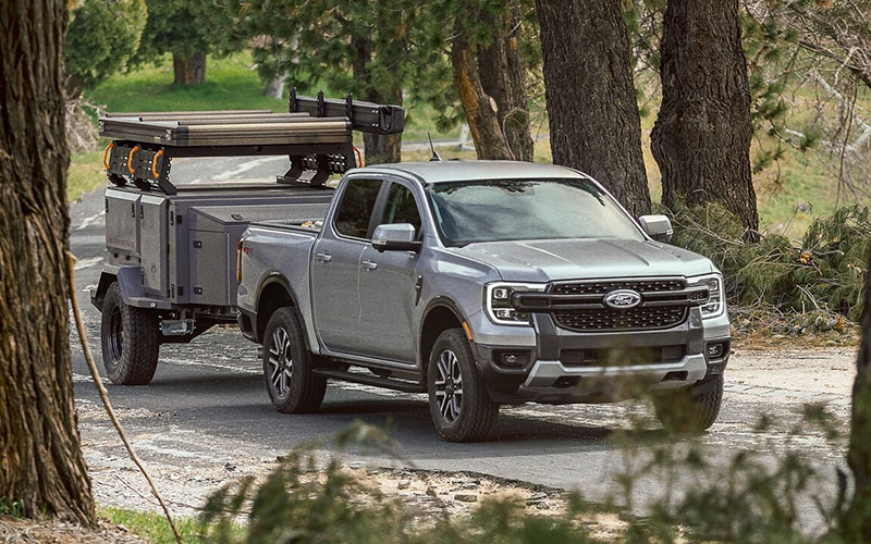 image of red ford ranger towing boat