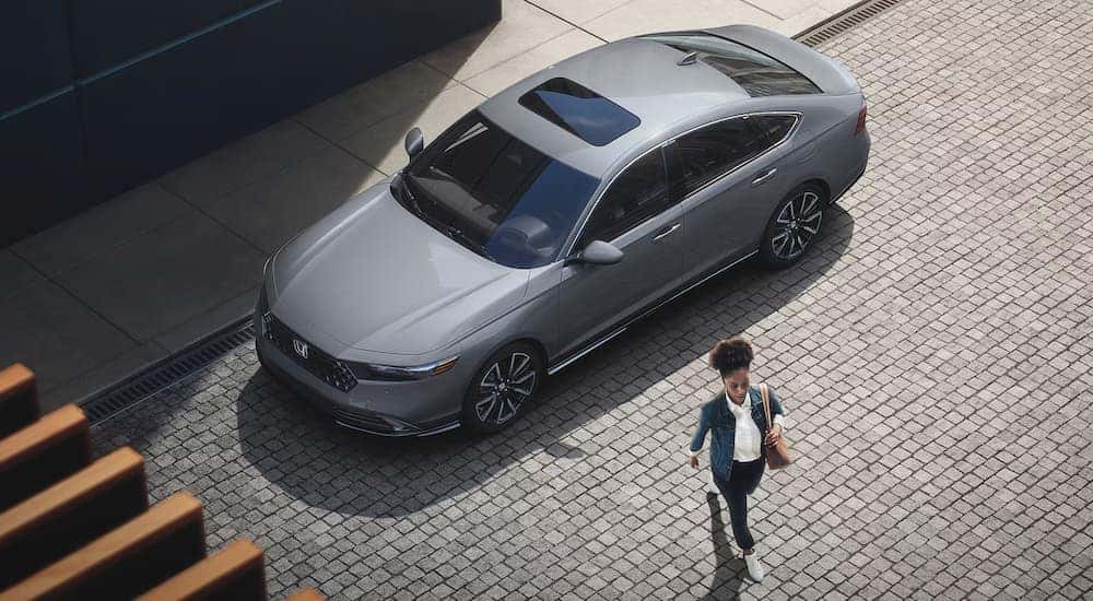Grey 2023 Honda Accord Touring from a high angle while parked on a city street