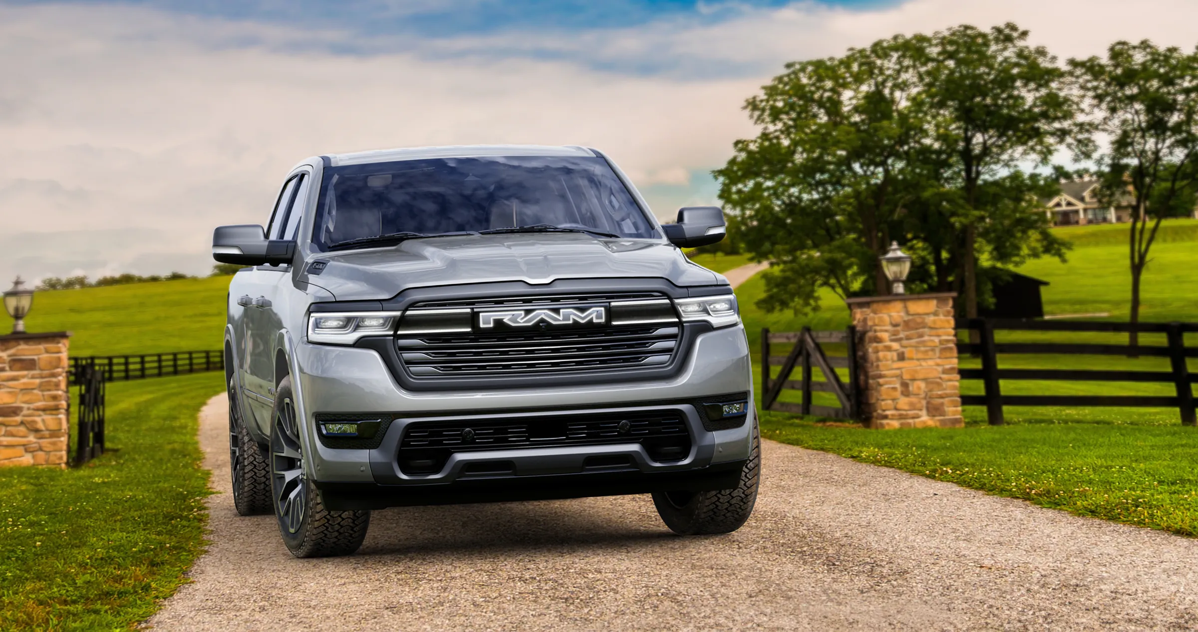 New 2026 Silver RAM 1500 pickup truck parked in a residential driveway