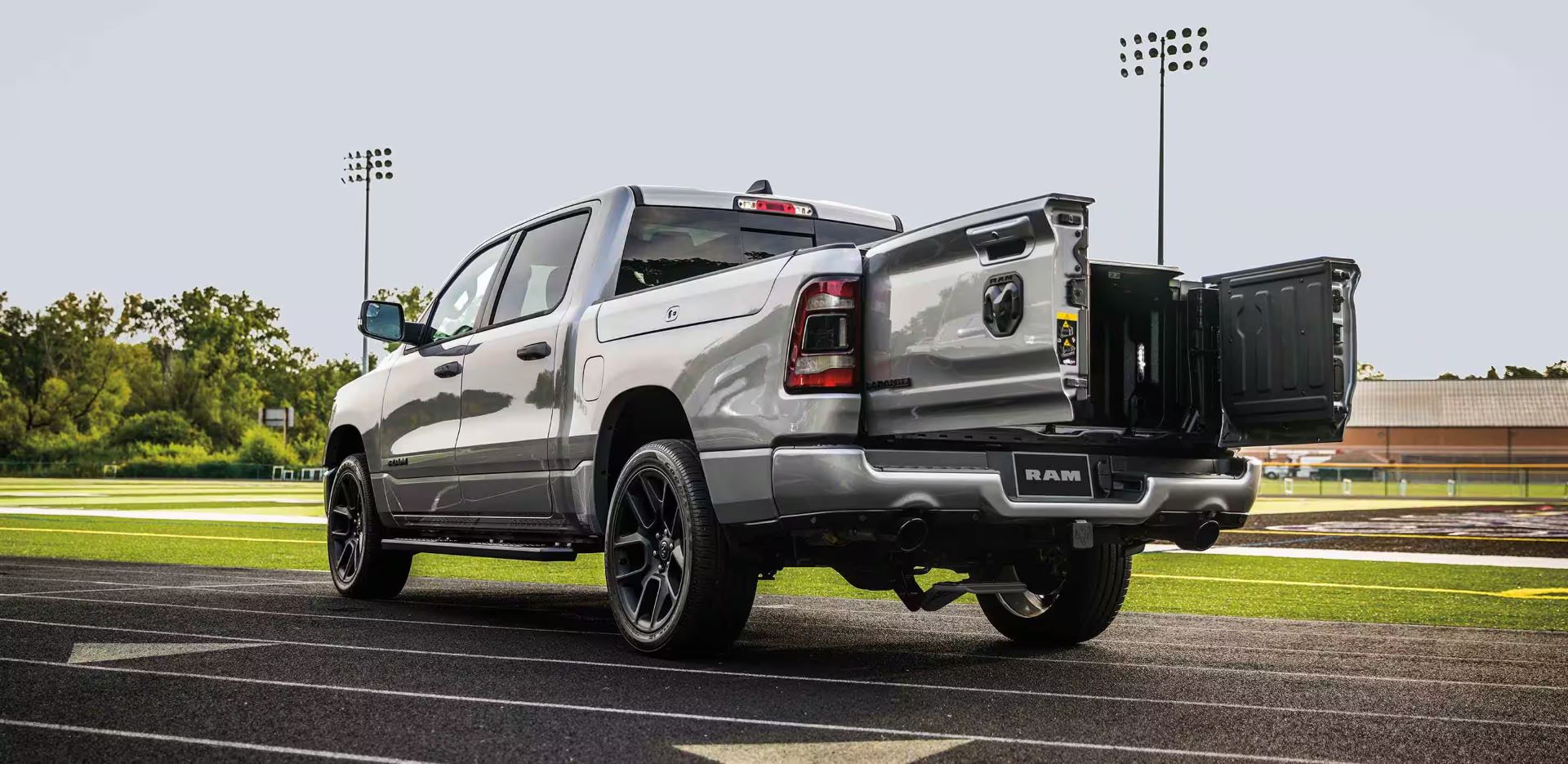 a silver truck parked on a track