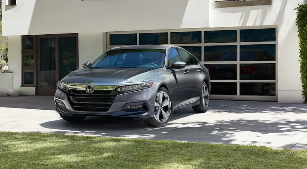 A gray 2020 Honda Accord Touring is shown parked on a driveway.