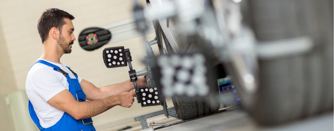 Mechanic performing a tire alignment