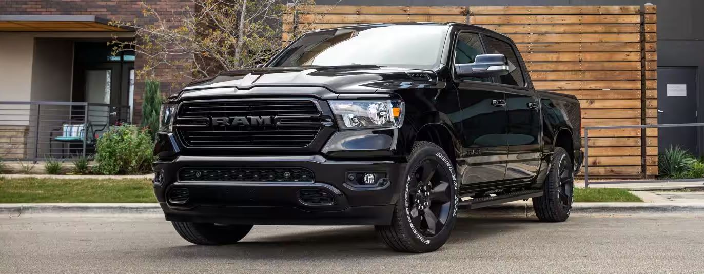 black 2024 RAM 1500 parked in driveway