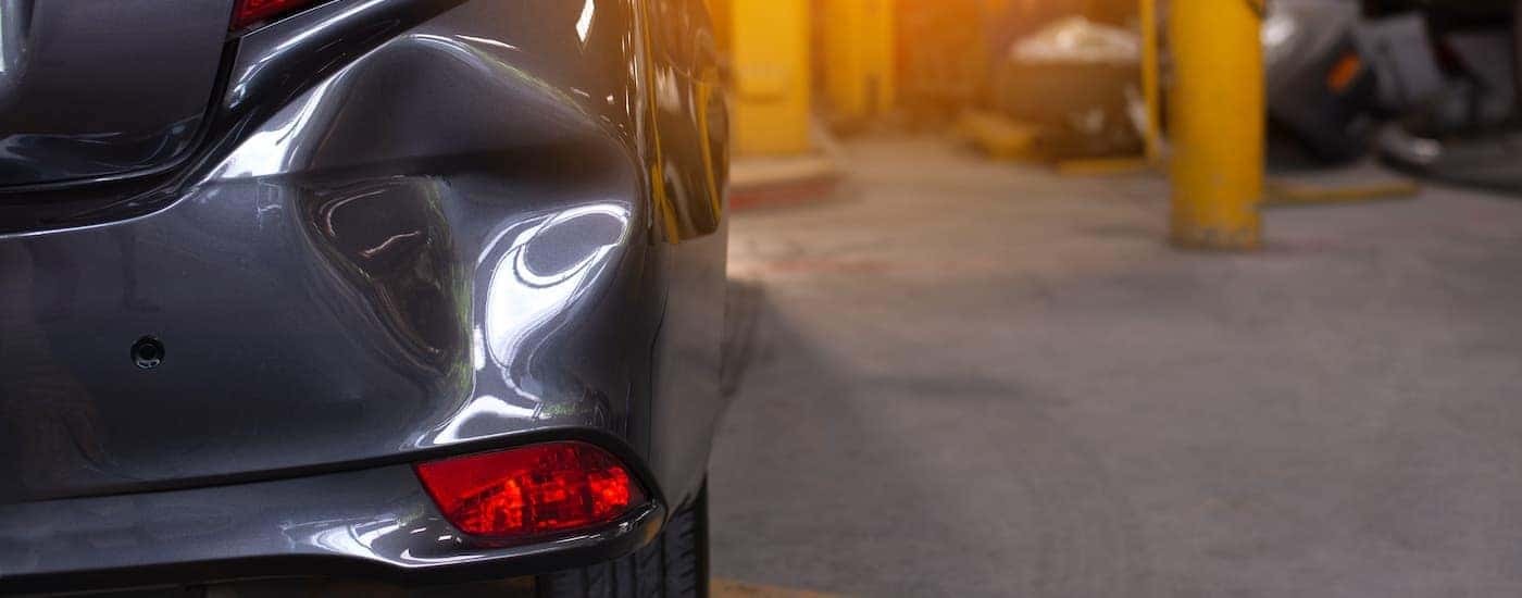 A dented car is shown in close up