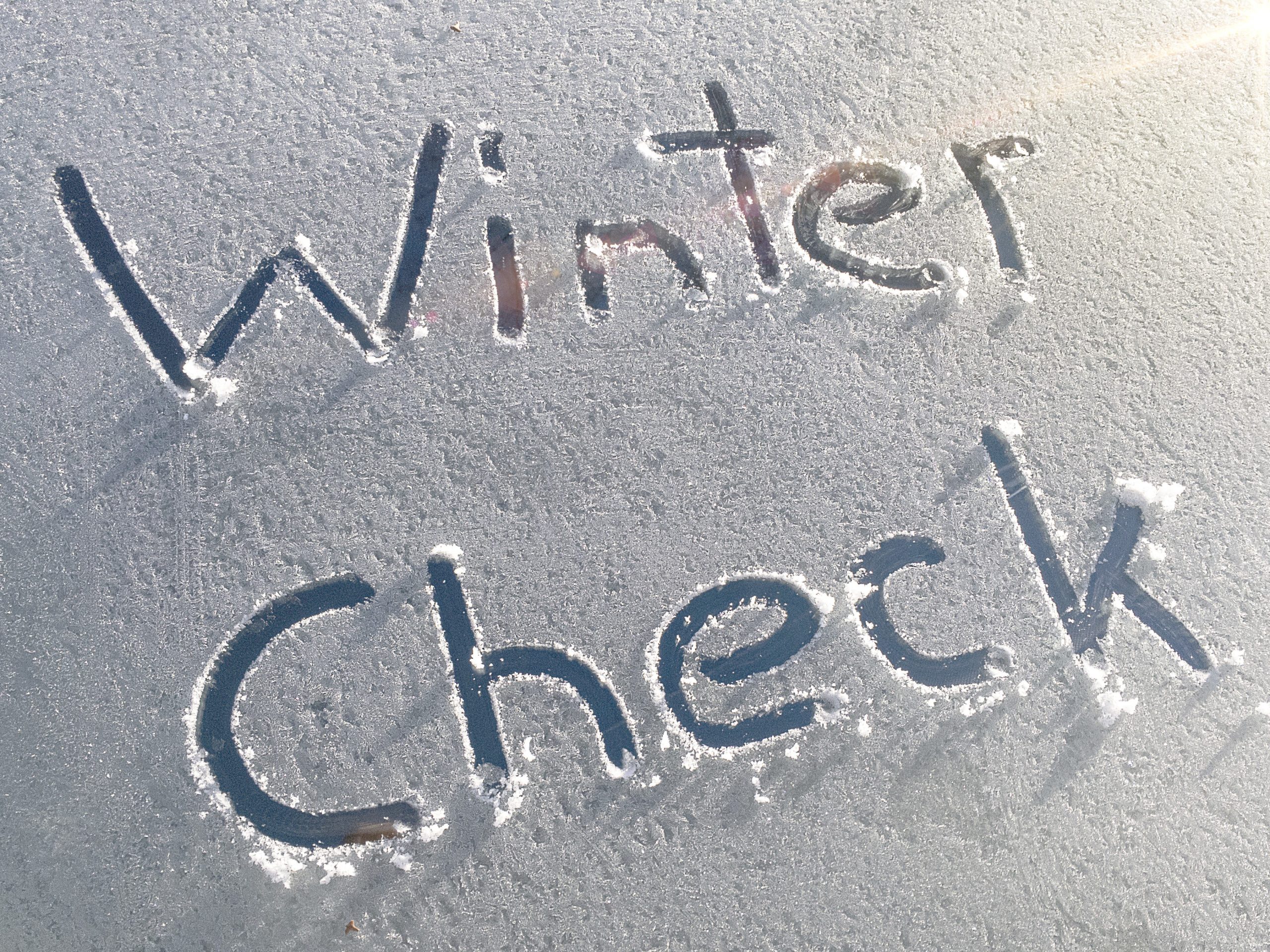 winter check written in snow