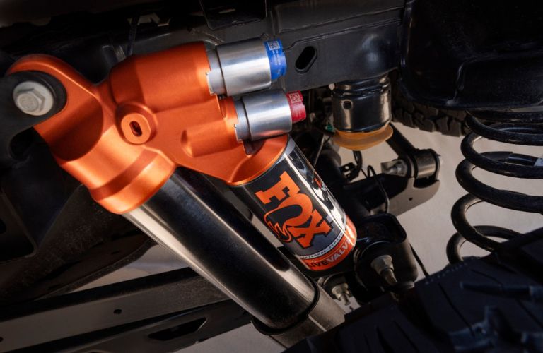 Orange 2024 Ford Raptor FOX Dual Live Valve Shocks