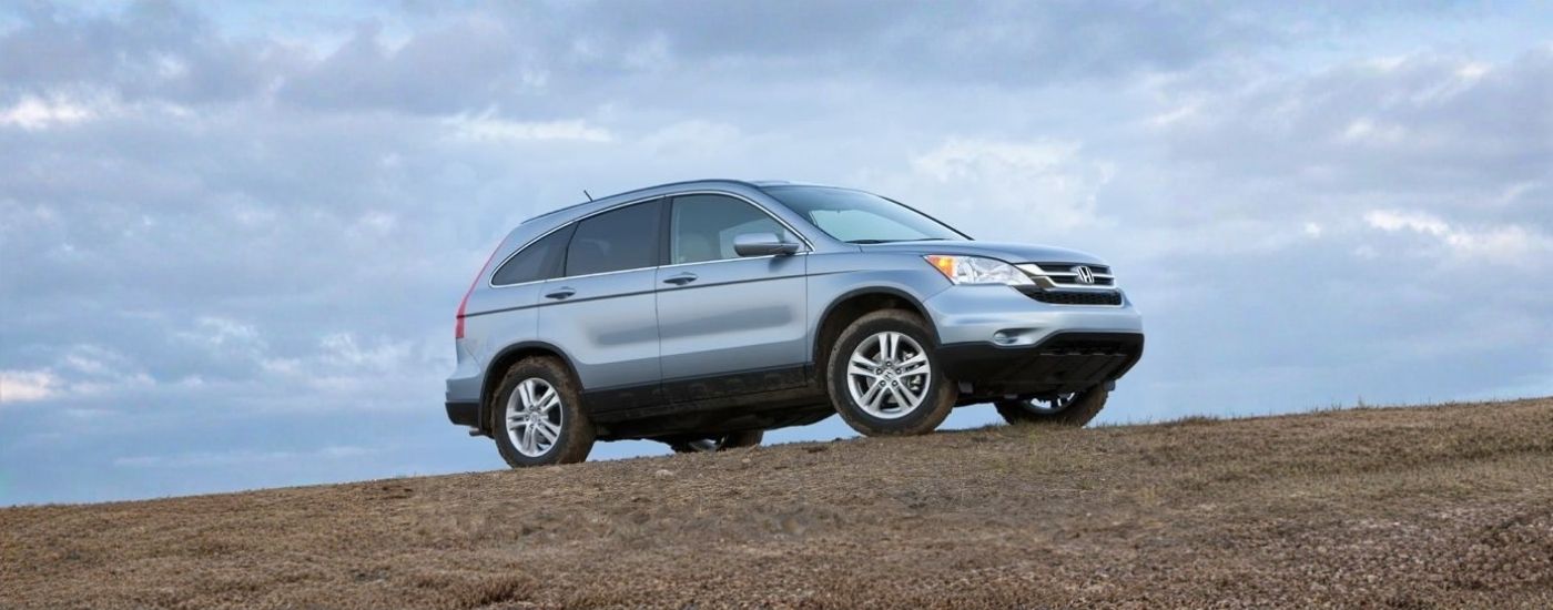Grey 2011 used Honda CR-V for sale near Greece parked off-road