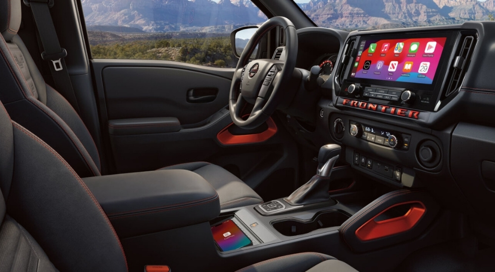 Black dash in a 2025 Nissan Frontier at a Nissan dealer near Golden Valley