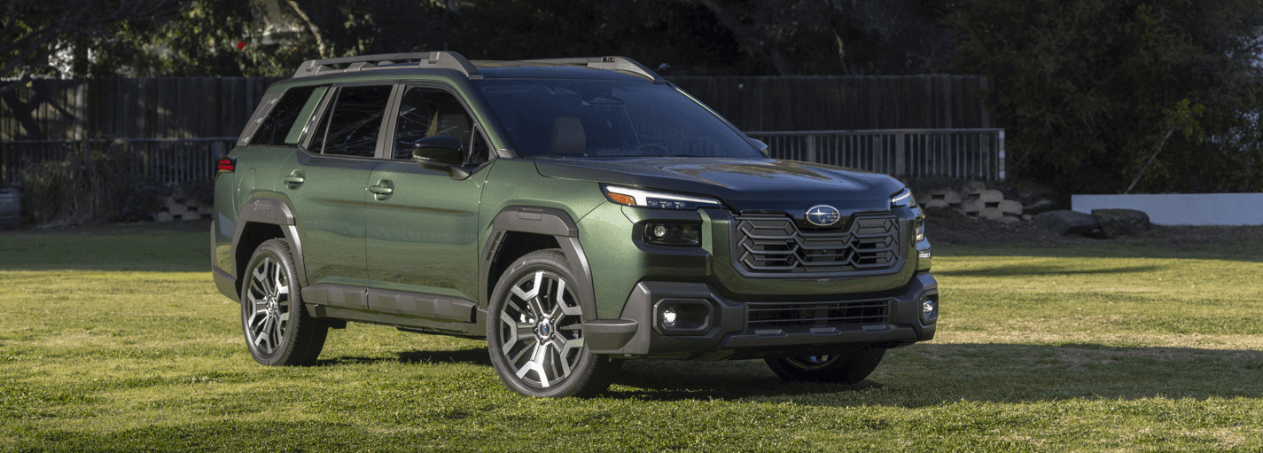 Green 2026 Subaru Outback parked on grass