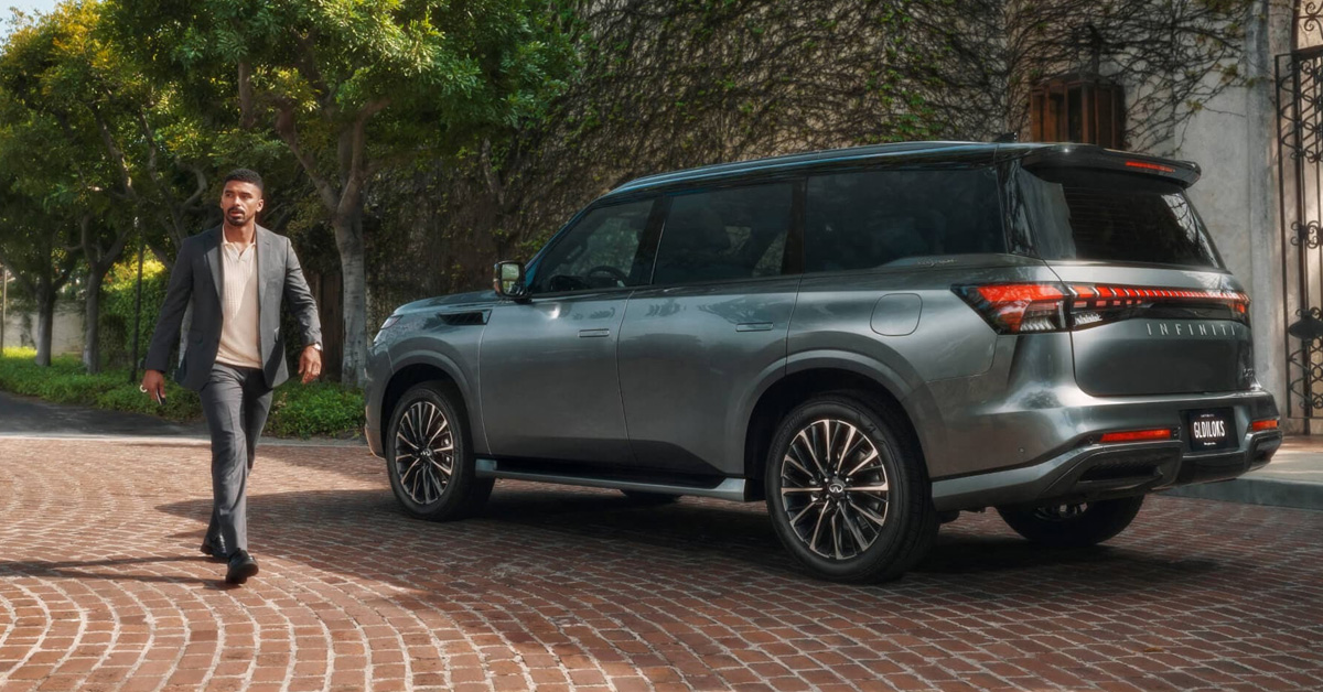 2026 INFINITI QX80 Man Walks Near SUV