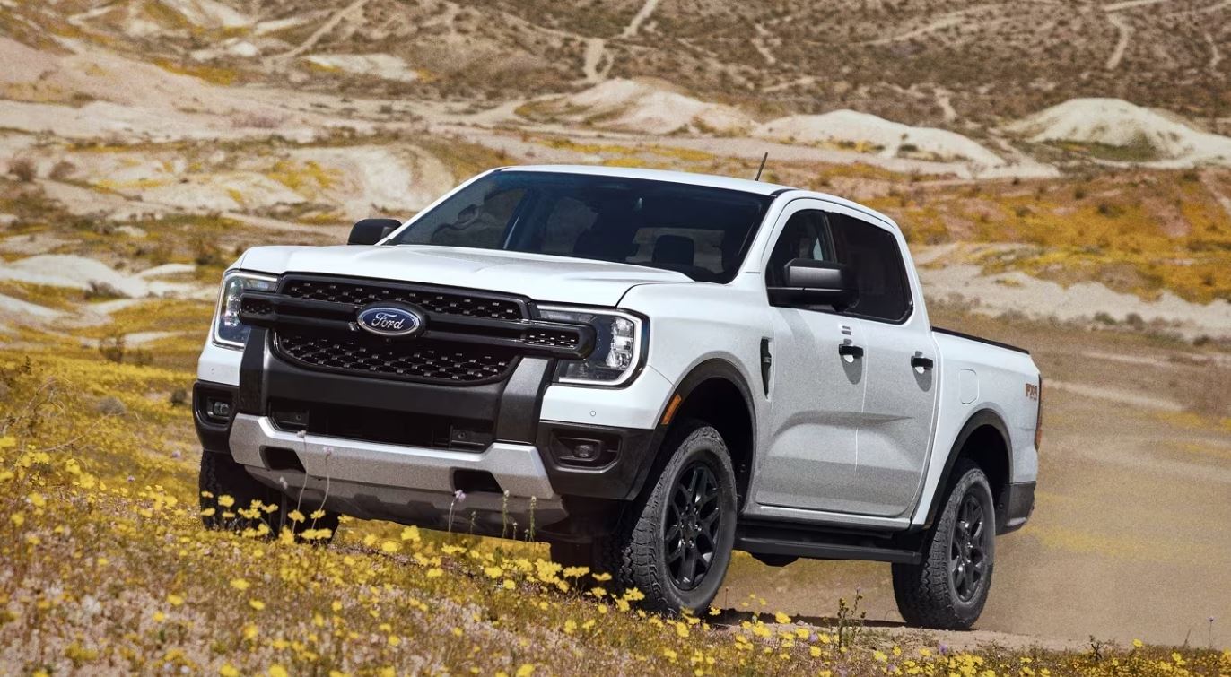 white 2024 Ford Ranger off-roading