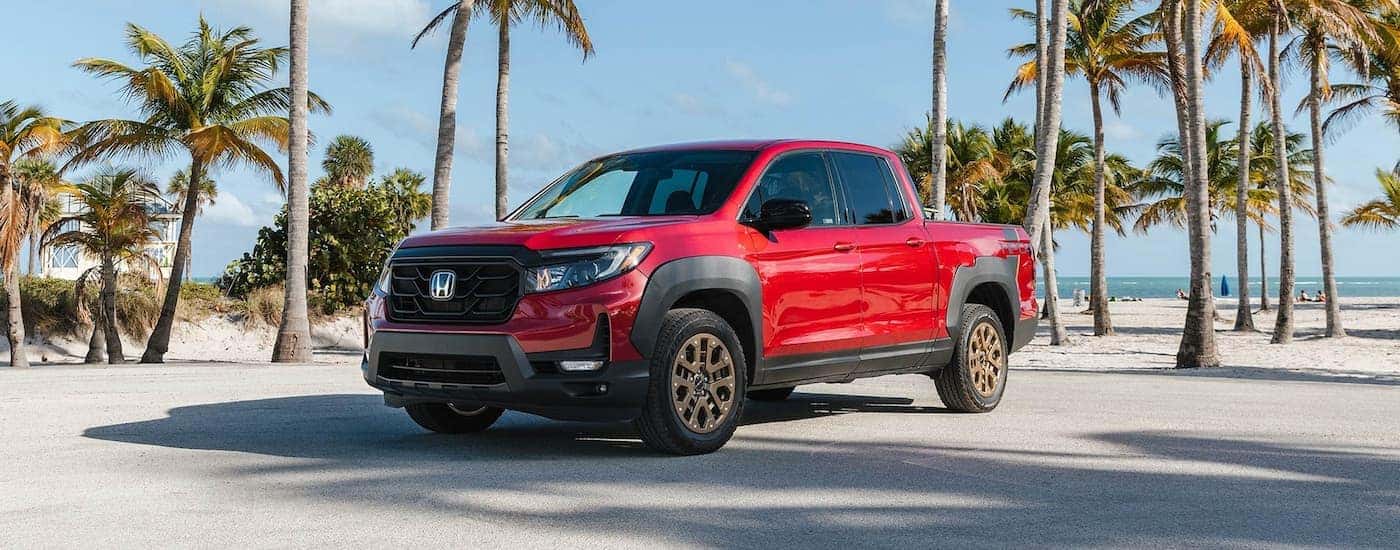 A red 2025 Honda Ridgeline from the front.