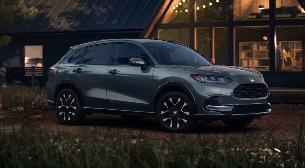 Grey 2026 Honda HR-V EX-L parked in front of a cabin