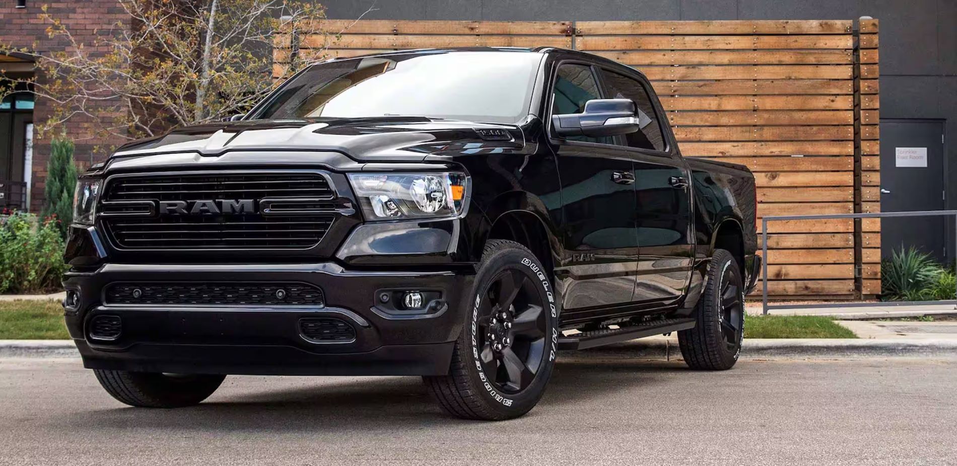 A black ram truck sitting parked.