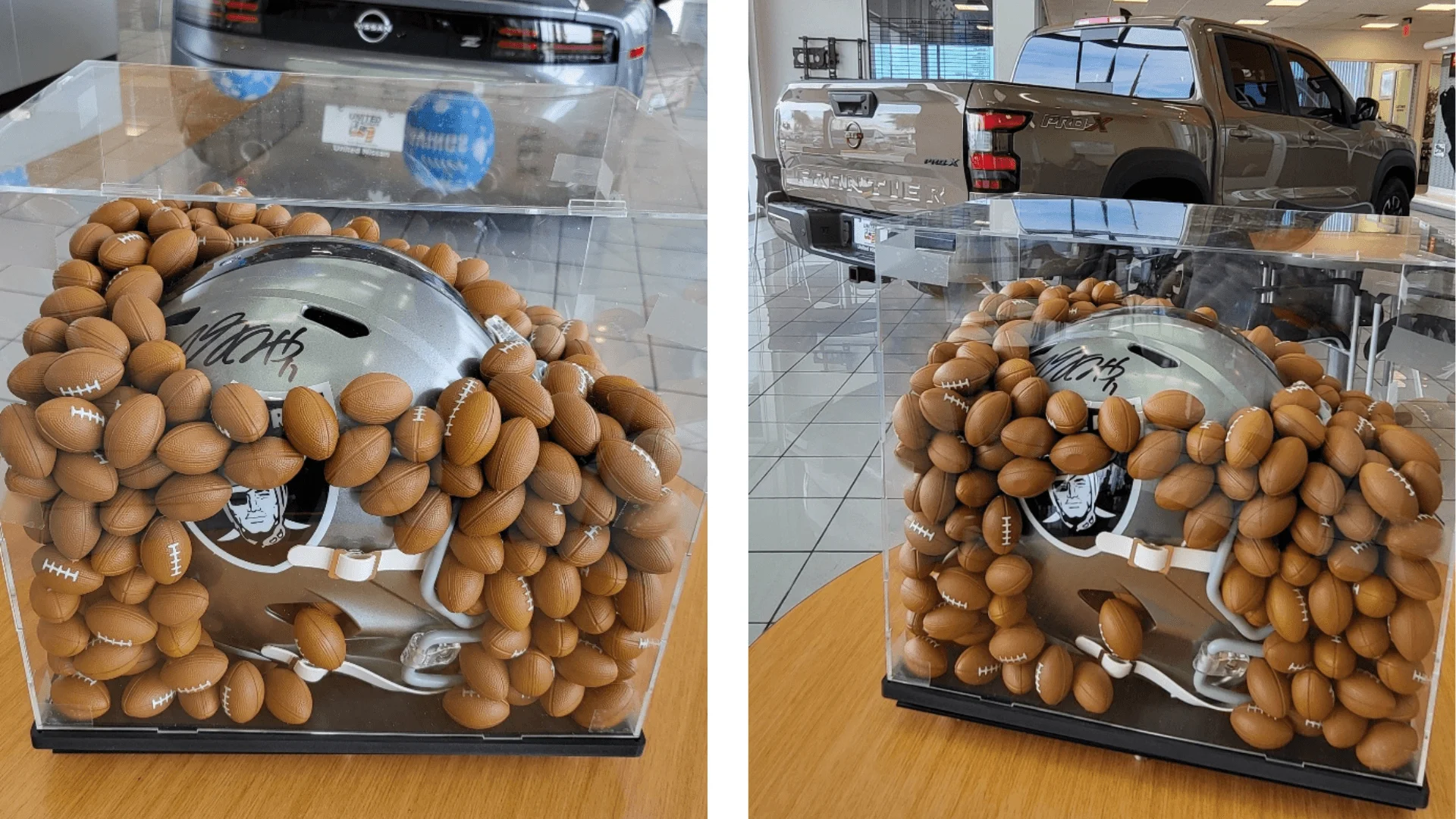 Autographed Las Vegas Raiders helmet in a display case filled with tiny footballs at United Nissan