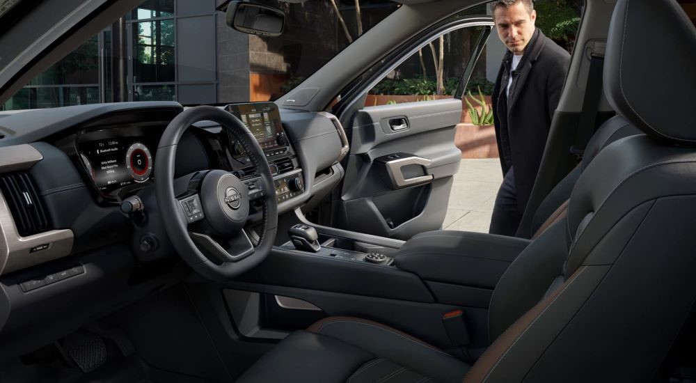 Person entering the a 2025 Nissan Pathfinder