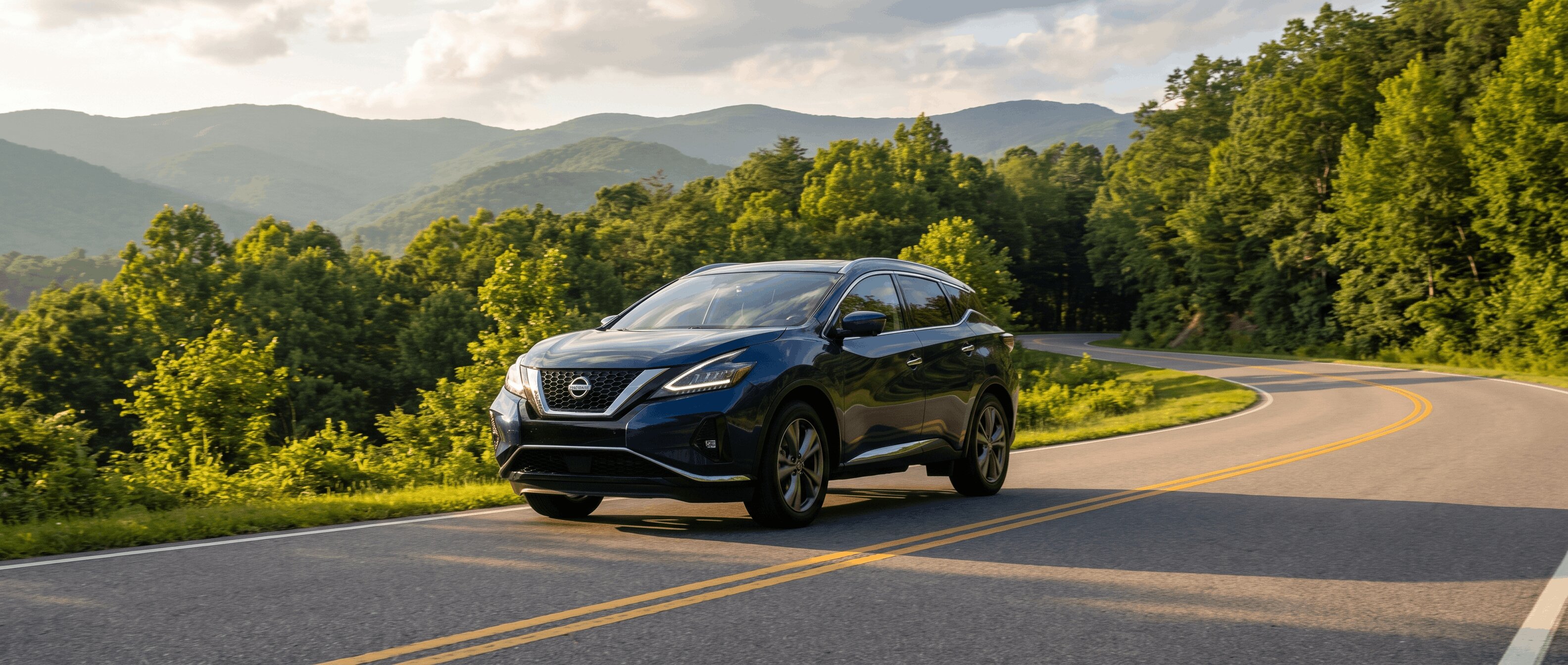 2026 Nissan Murano on a winding mountain highway near Asheville NC on a summer weekend trip