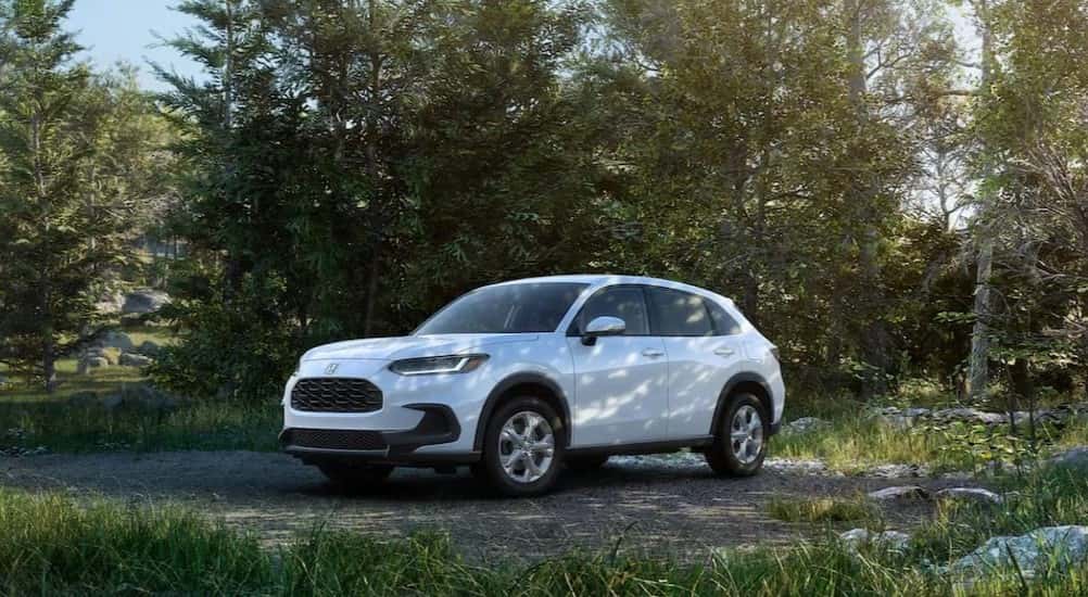 A white 2025 Honda HR-V parked off-road.