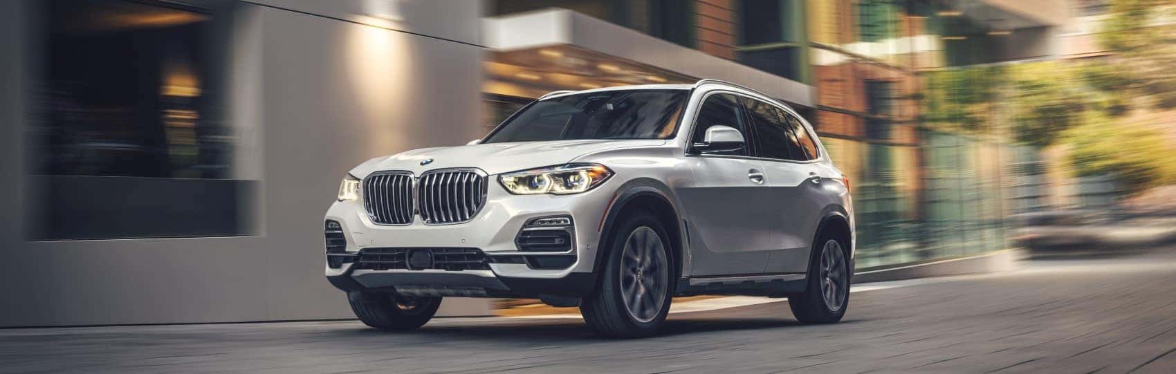 BMW X5 driving through city