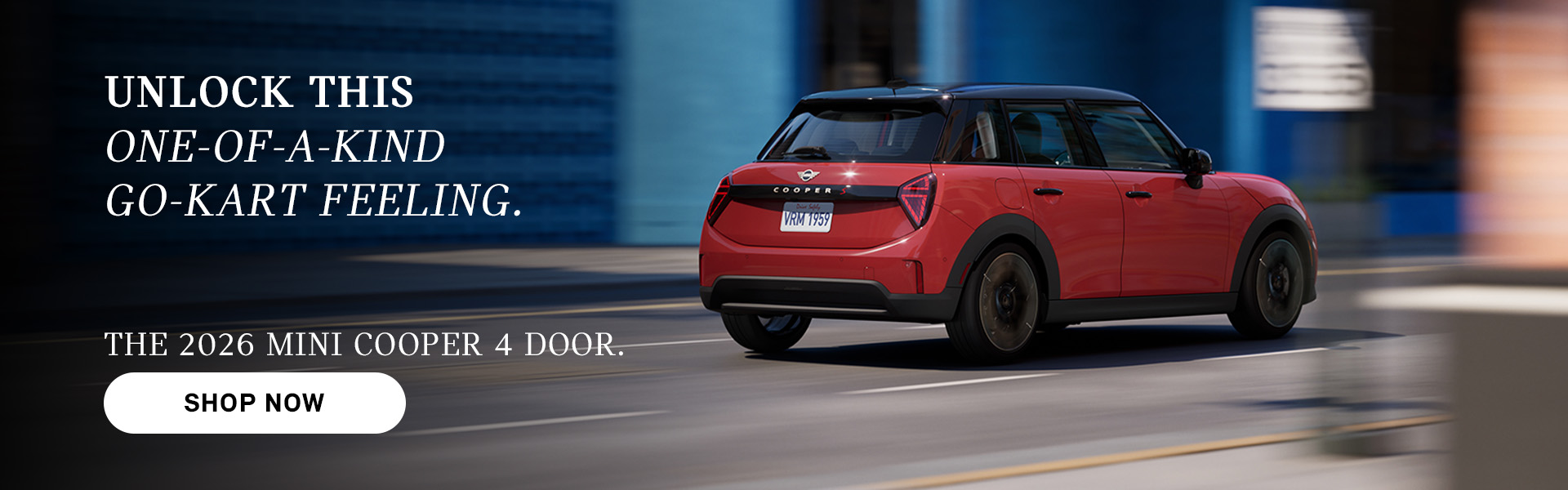 Red MINI Cooper 4-door driving on a city street, with motion blur in the background and ad text promoting the 2026 model and a “Shop Now” button.