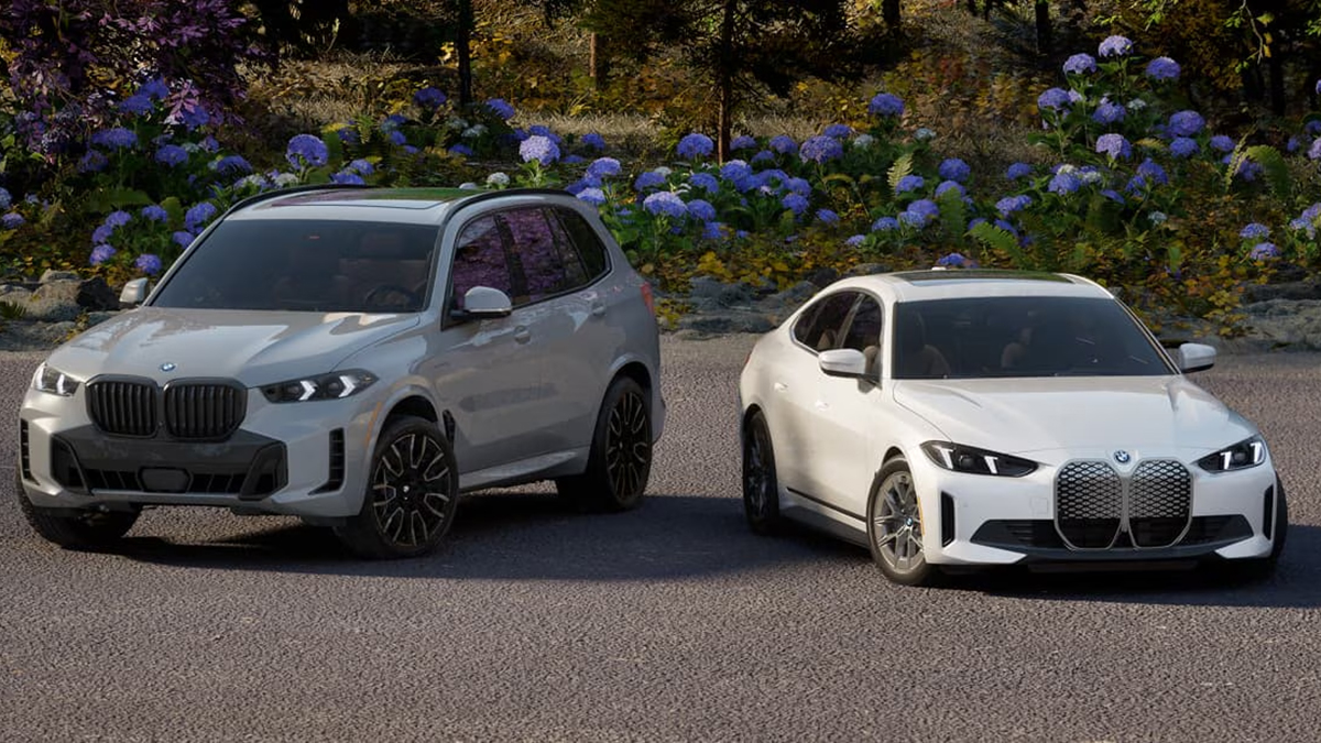 Two BMWs side by side with flowers