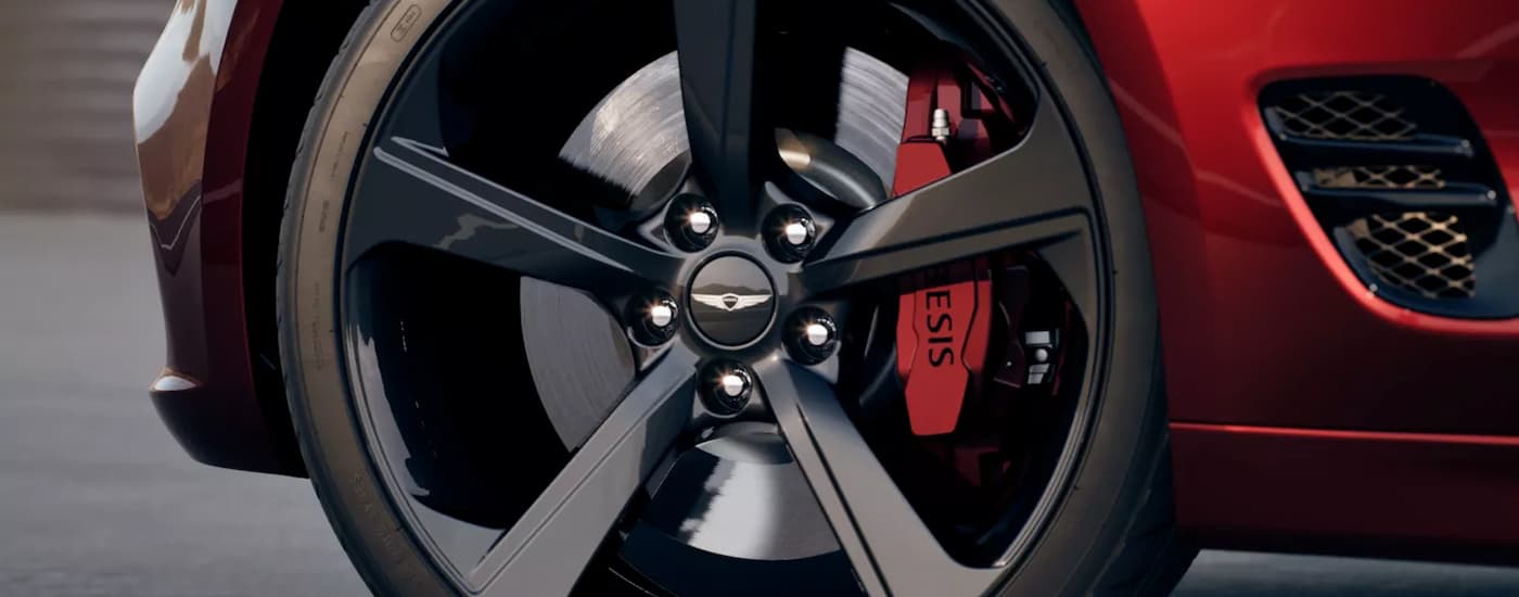 Tire and side of a red 2026 Genesis G70