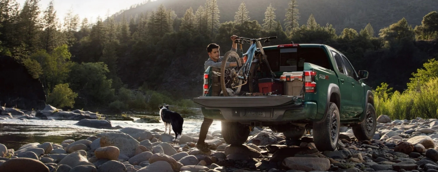 Green 2025 Nissan Frontier PRO-4X parked off-road