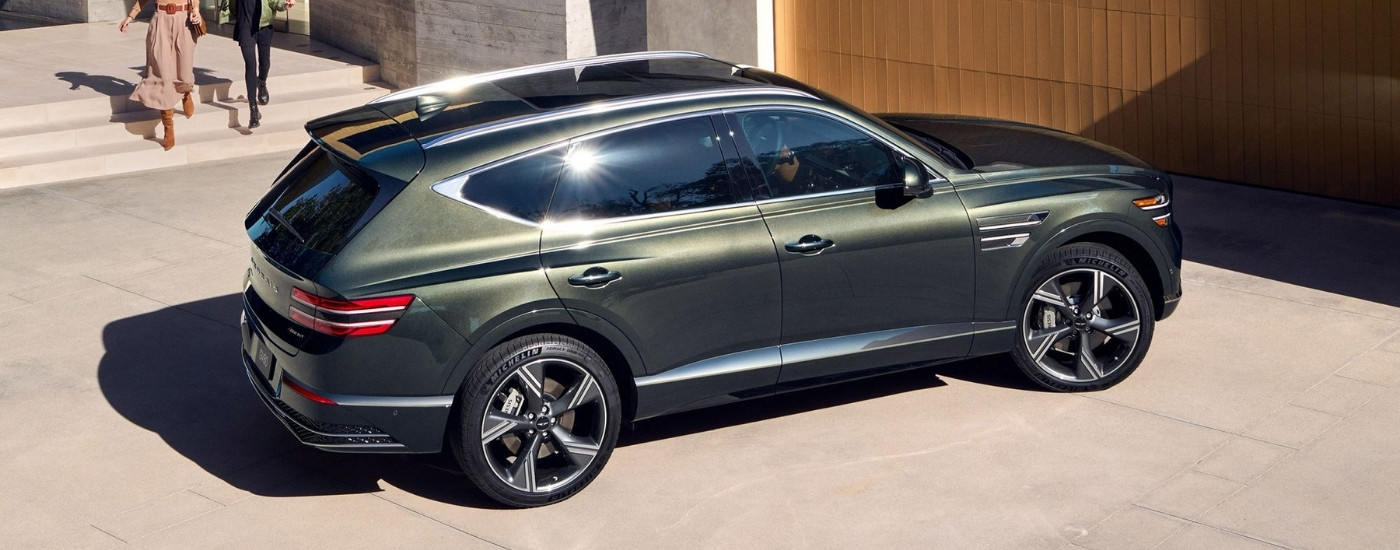 Green 2025 Genesis GV80 parked on a driveway