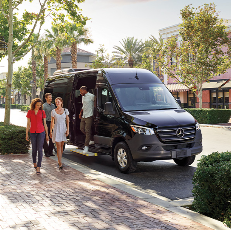 People file out of a 2025 Mercedes-Benz Sprinter van.