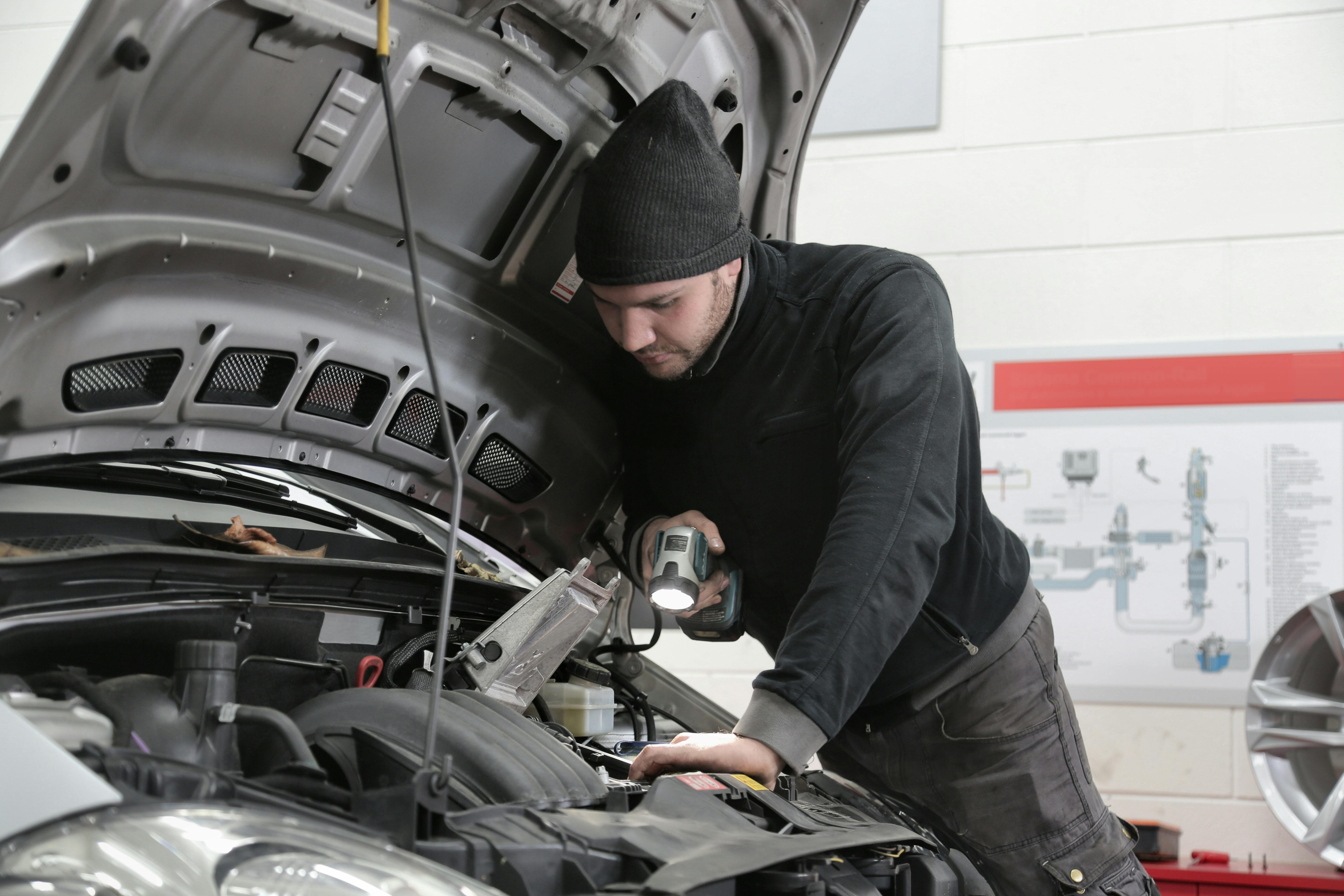 Kunes Auto Group technician using diagnostic tools on a Ram truck