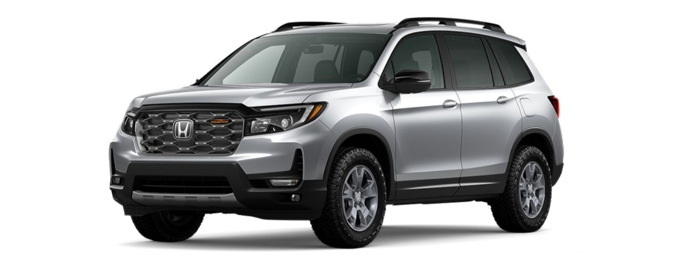 A silver 2023 Honda Passport Trailsport is angled left.