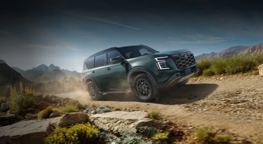 Grey 2025 Nissan Armada PRO-4x driving on a trail