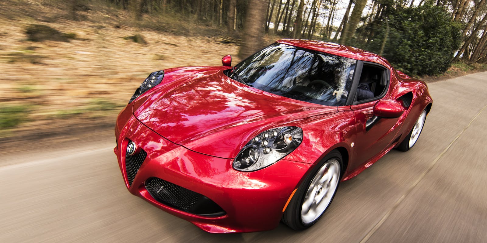 2026 Dodge Hornet styled compact SUV on an open road at sunset