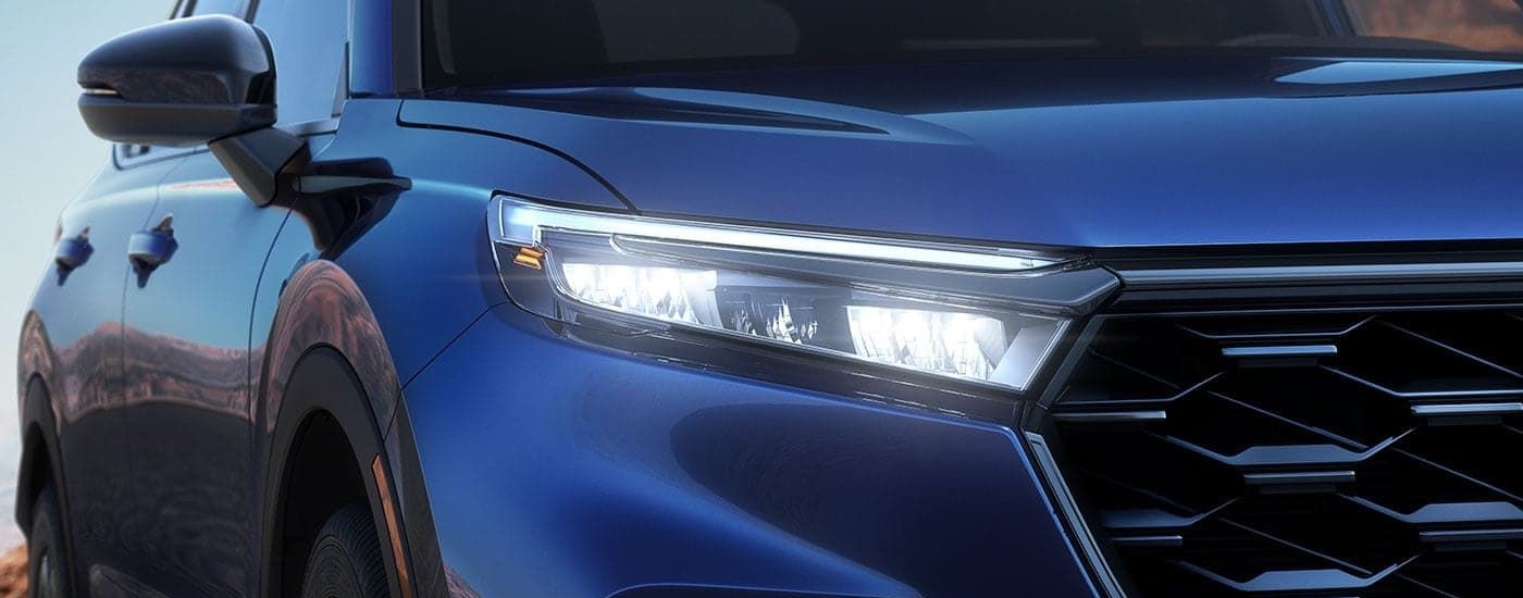 Passenger side taillight on a blue 2026 Honda CR-V Sport Touring Hybrid