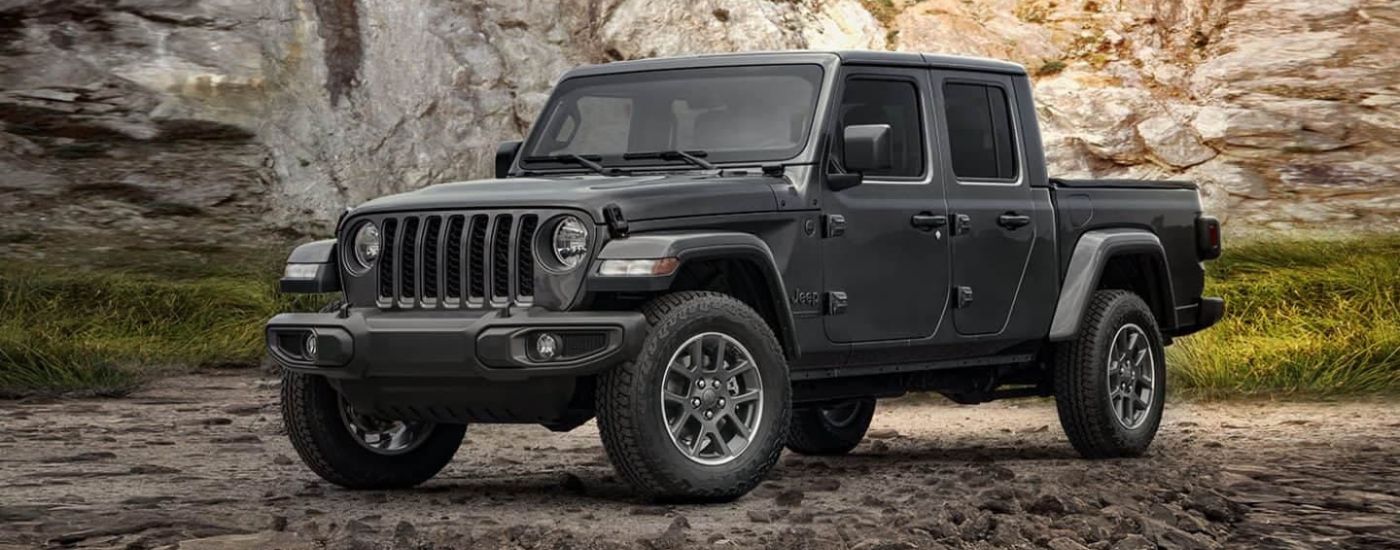 A grey  2021 Jeep Gladiator isa shown off-road.