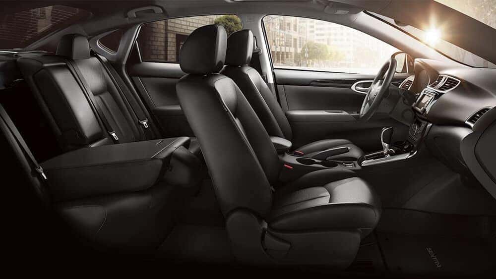 2018 Nissan Sentra black leather seats with the rear seat folded down