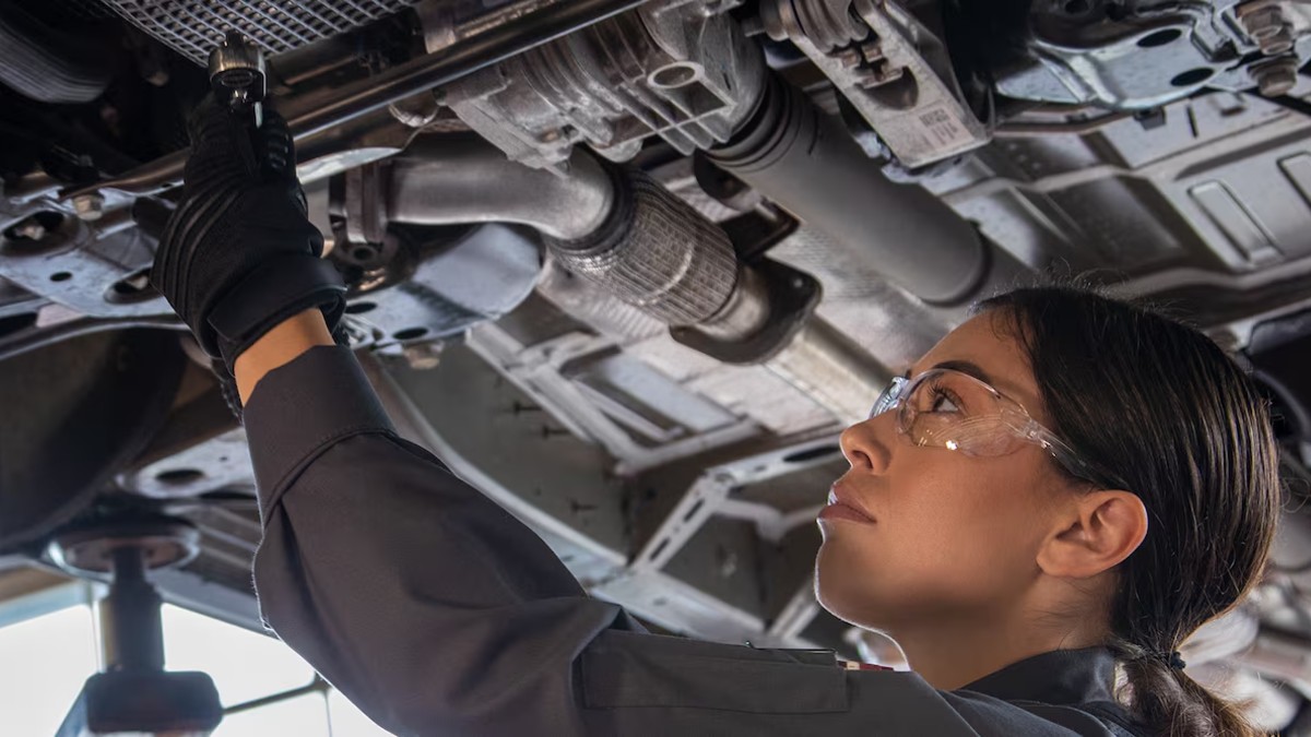 Chevy OEM Oil Change Woman Under Raised Vehicle