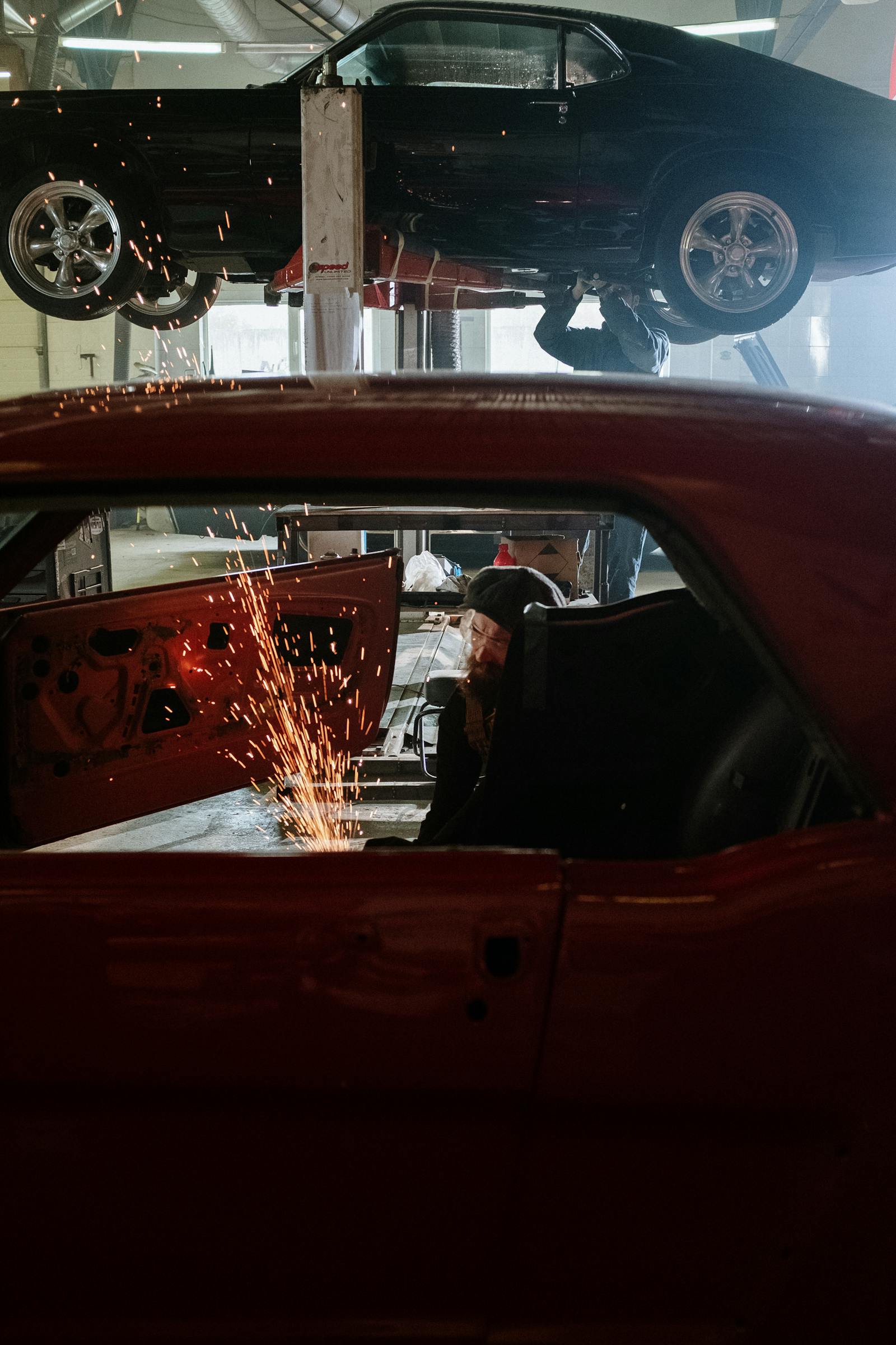 Automotive technician servicing a Ford truck in Sterling near Amboy IL