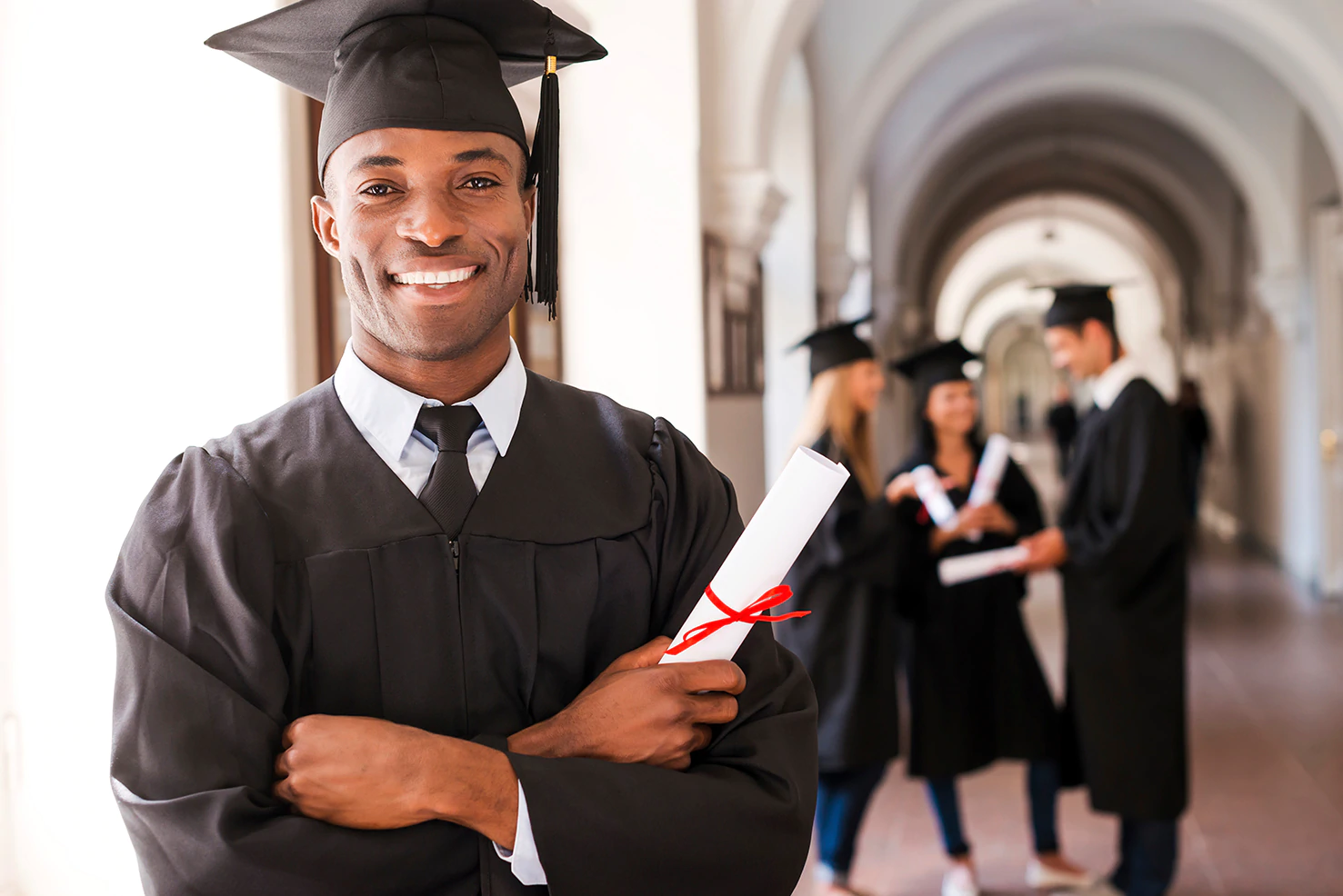 A college graduate holding a diploma.