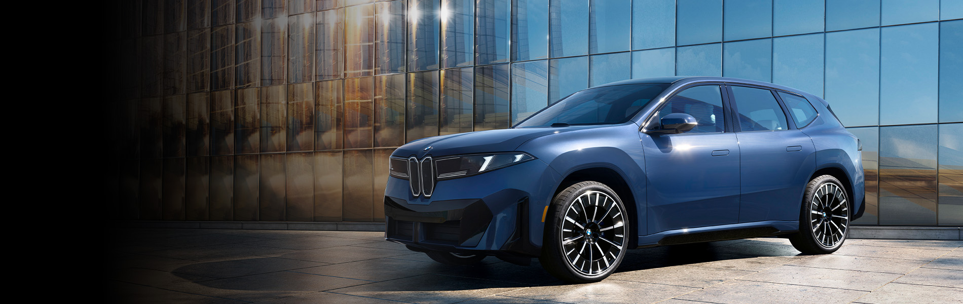 The BMW iX3 SUV parked. Click to learn more.