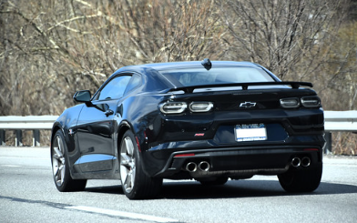 Black Chevy Camaro photographed from behind.