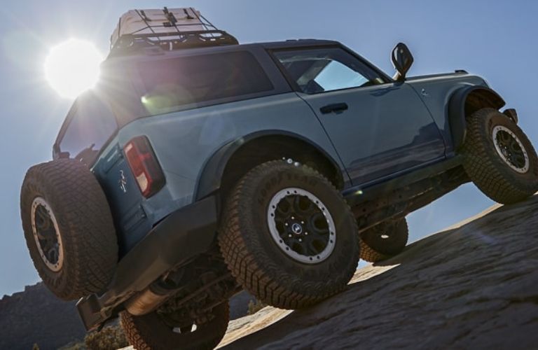 Blue 2023 Ford Bronco Rear Exterior on Rocky Incline