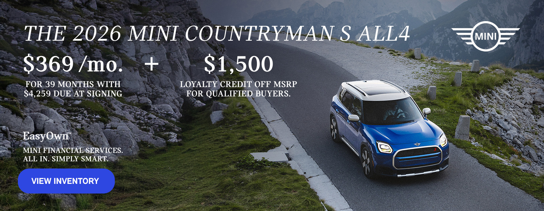 Front view of a blue MINI Countryman  driving on a mountainous road.