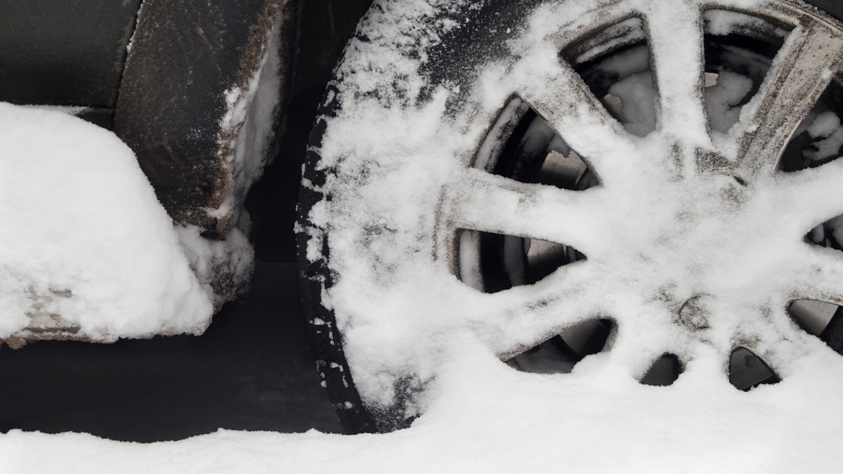 Vehicle Wheel Covered in Snow