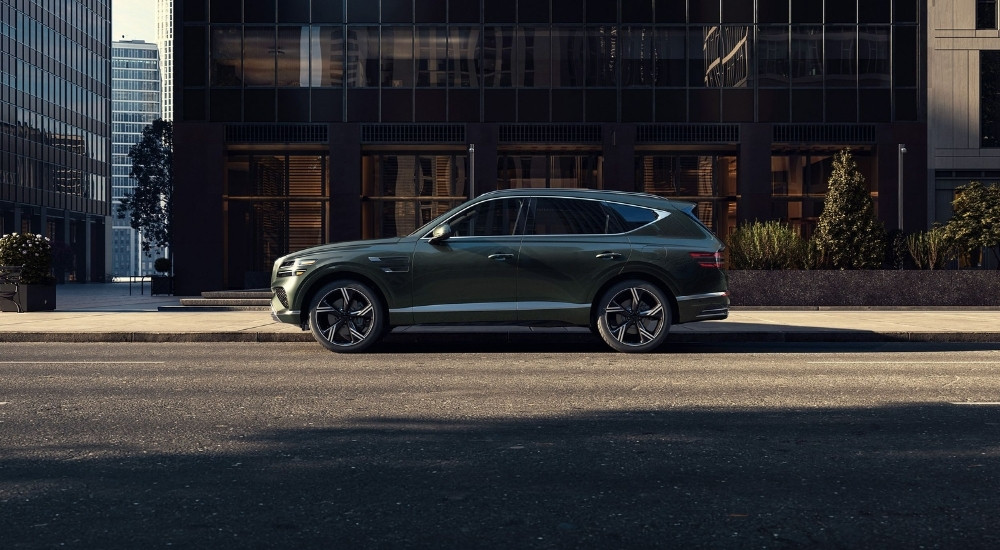 Grey 2026 Genesis GV80 SUV parked on a city street