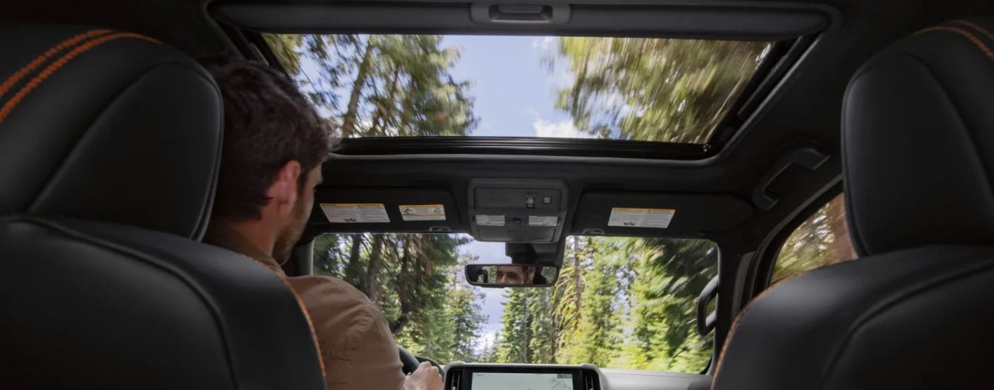 Person driving a 2026 Nissan Frontier PRO-4X 